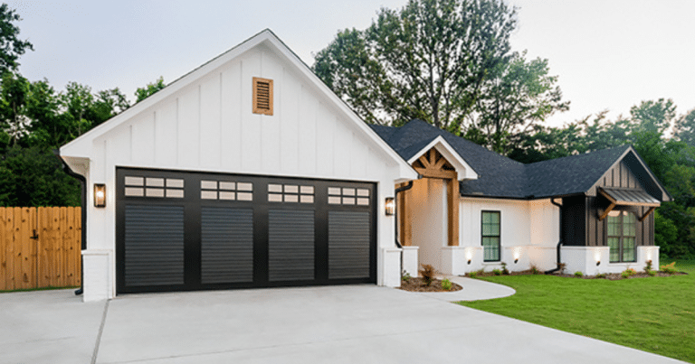 black garage doors on white house